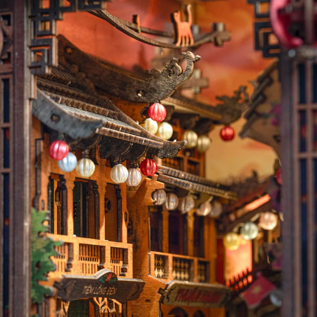 Hoi An Old Town book nook kit showcased on a wooden desk with ambient lighting