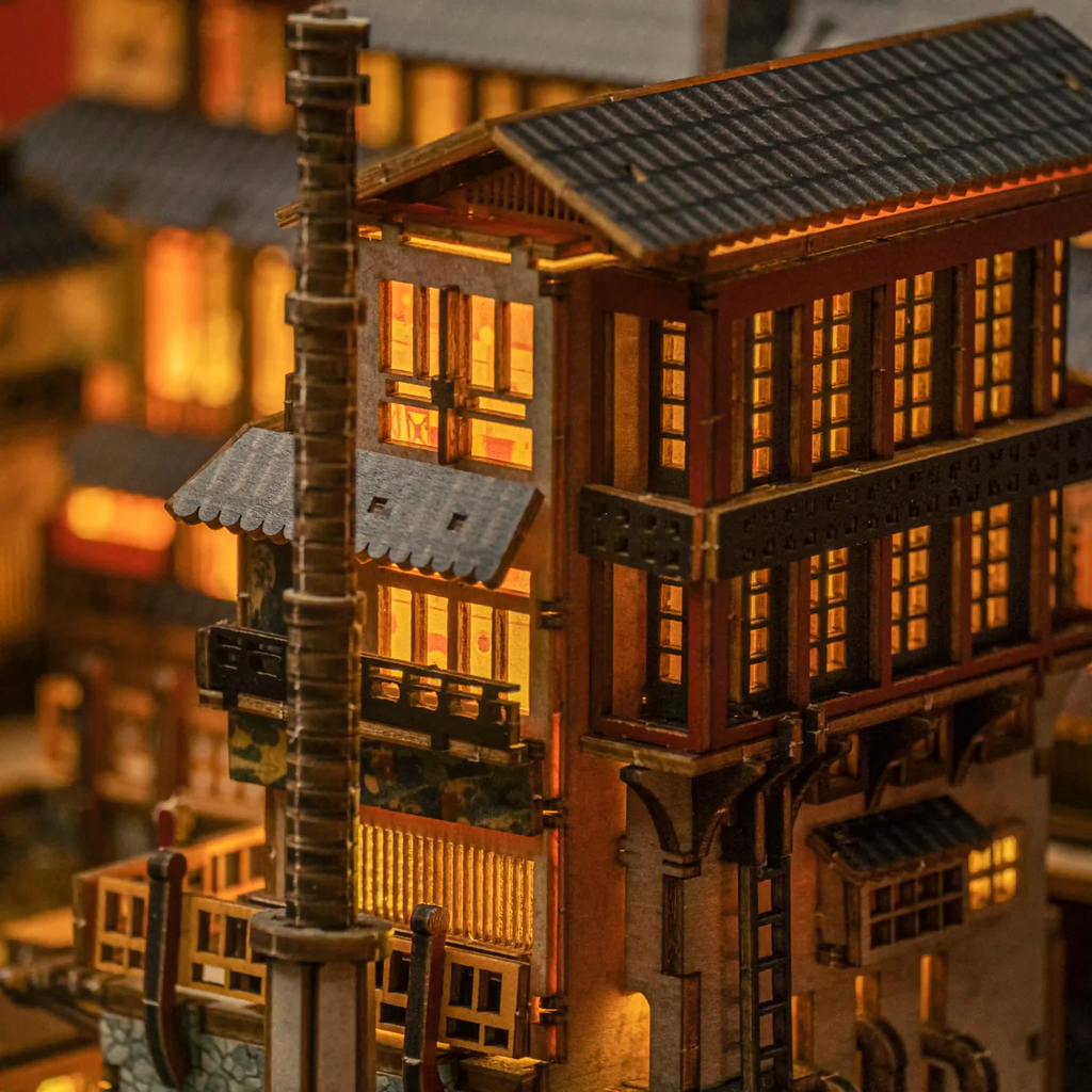 Atmospheric night shot of Ginzan Onsen book nook kit with glowing lanterns