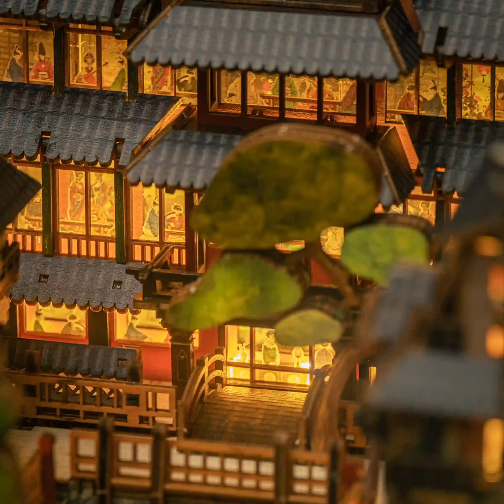 Ginzan Onsen book nook kit positioned between book stacks on shelf